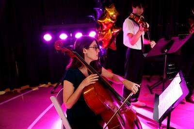 Student playing a cello